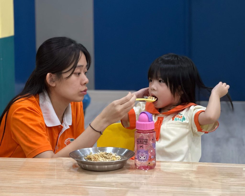 Children eating a freshly prepared preschool meal at My First Step Kindergarten in Damansara Jaya